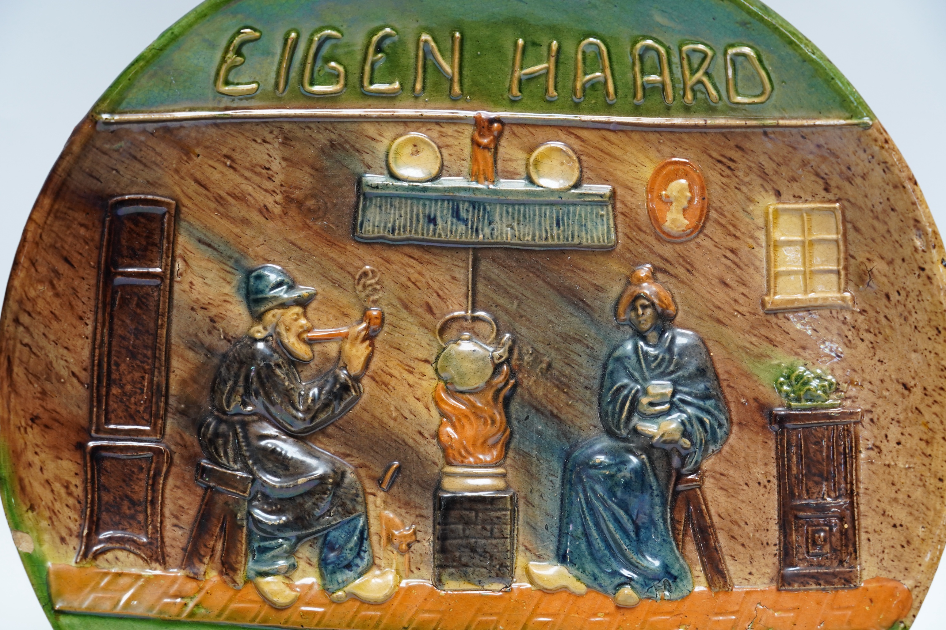 A Dutch pottery proverb plate, circa 1900, 31cm